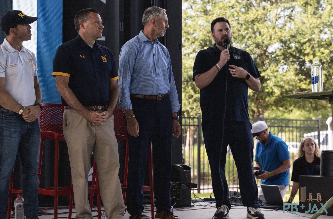 Randall speaking on stage